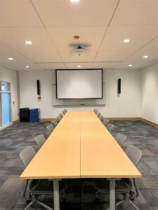 Room 101 with a full confrence like table.