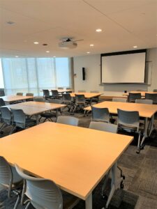 Room 104 with scattered tables.
