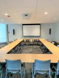 Room 104 with tables arranged into a rectangle.