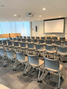 Room 104 with rows of chairs.