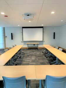 Room 104 with u shape tables.