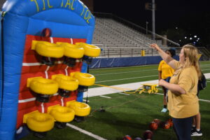 students playing with inflatable games.