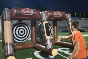 students throwing inflatable axes.