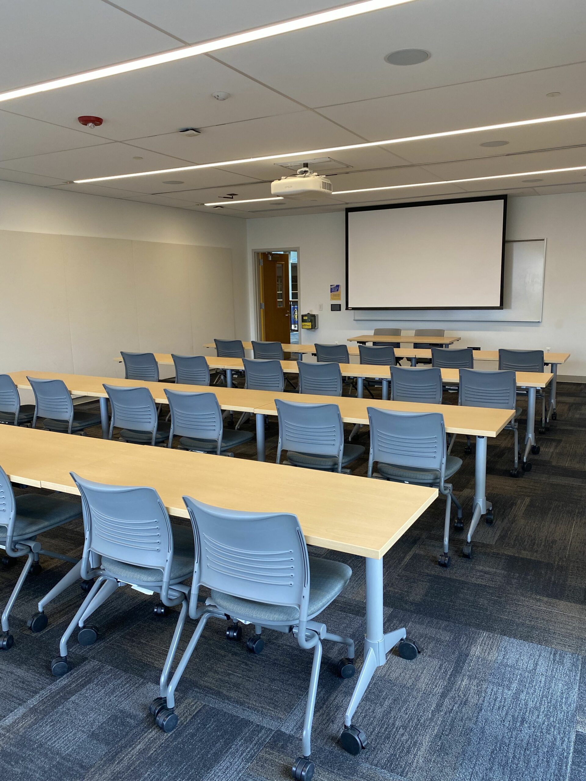 Room 222 with rows of tables.