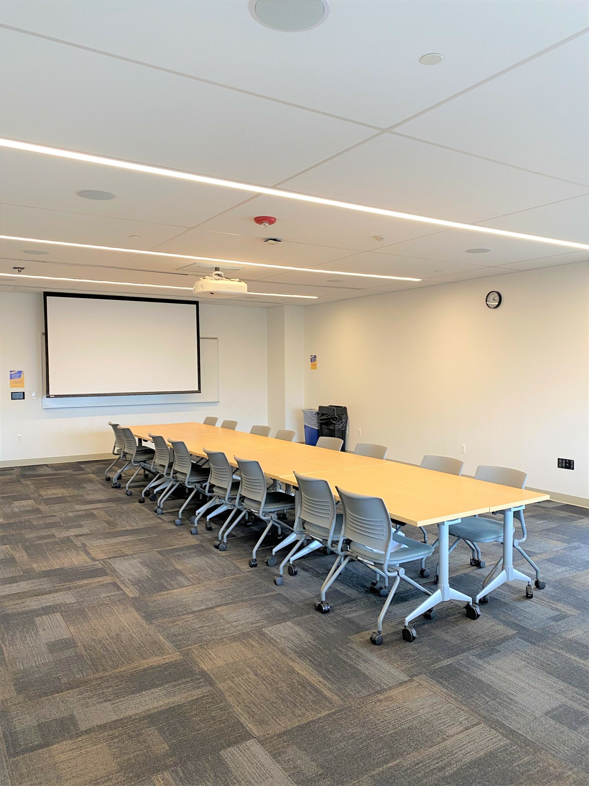 Room 222 with a conference table setup.